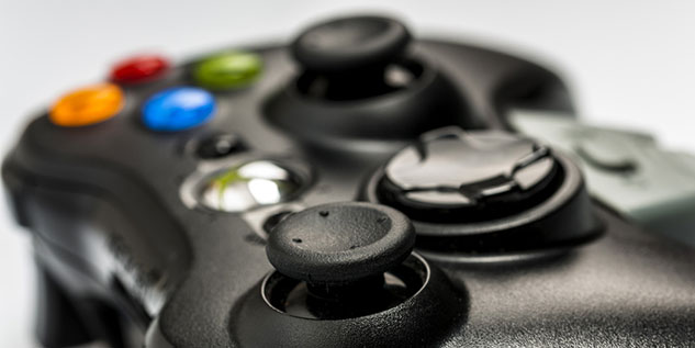 Schwarzer Controller mit vier verschiedenen Knöpfen.